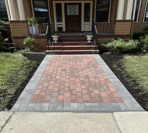 brick steps with brick walkway in front of house