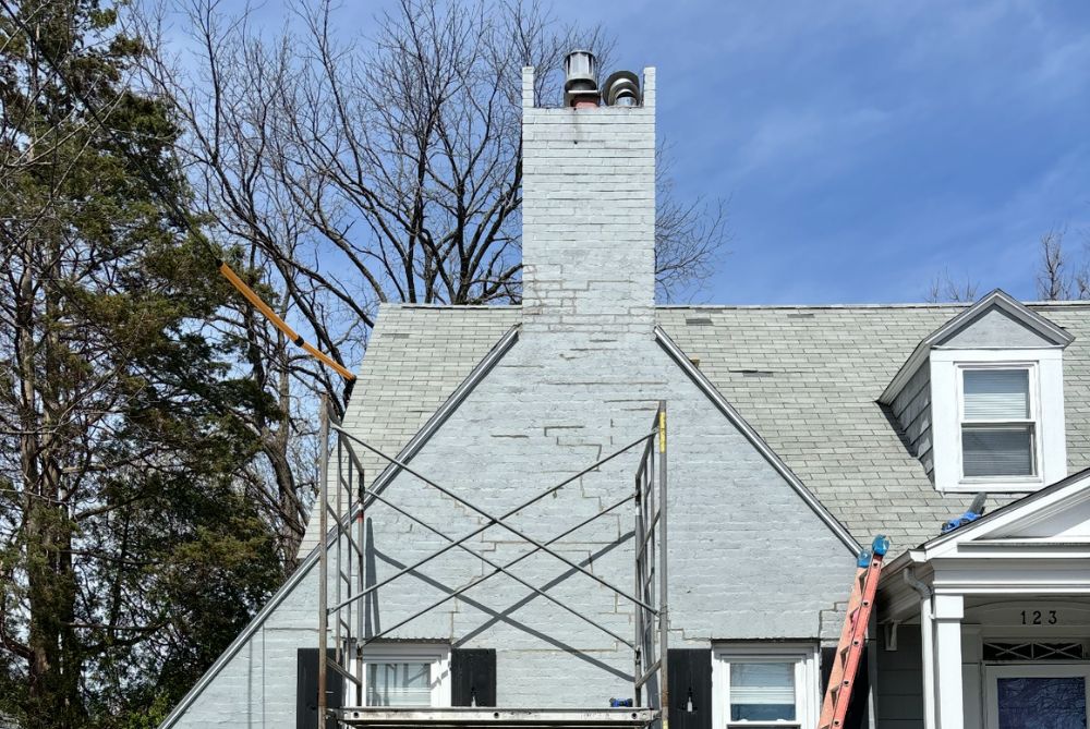 gray chimney being built on top of house in Massachusetts